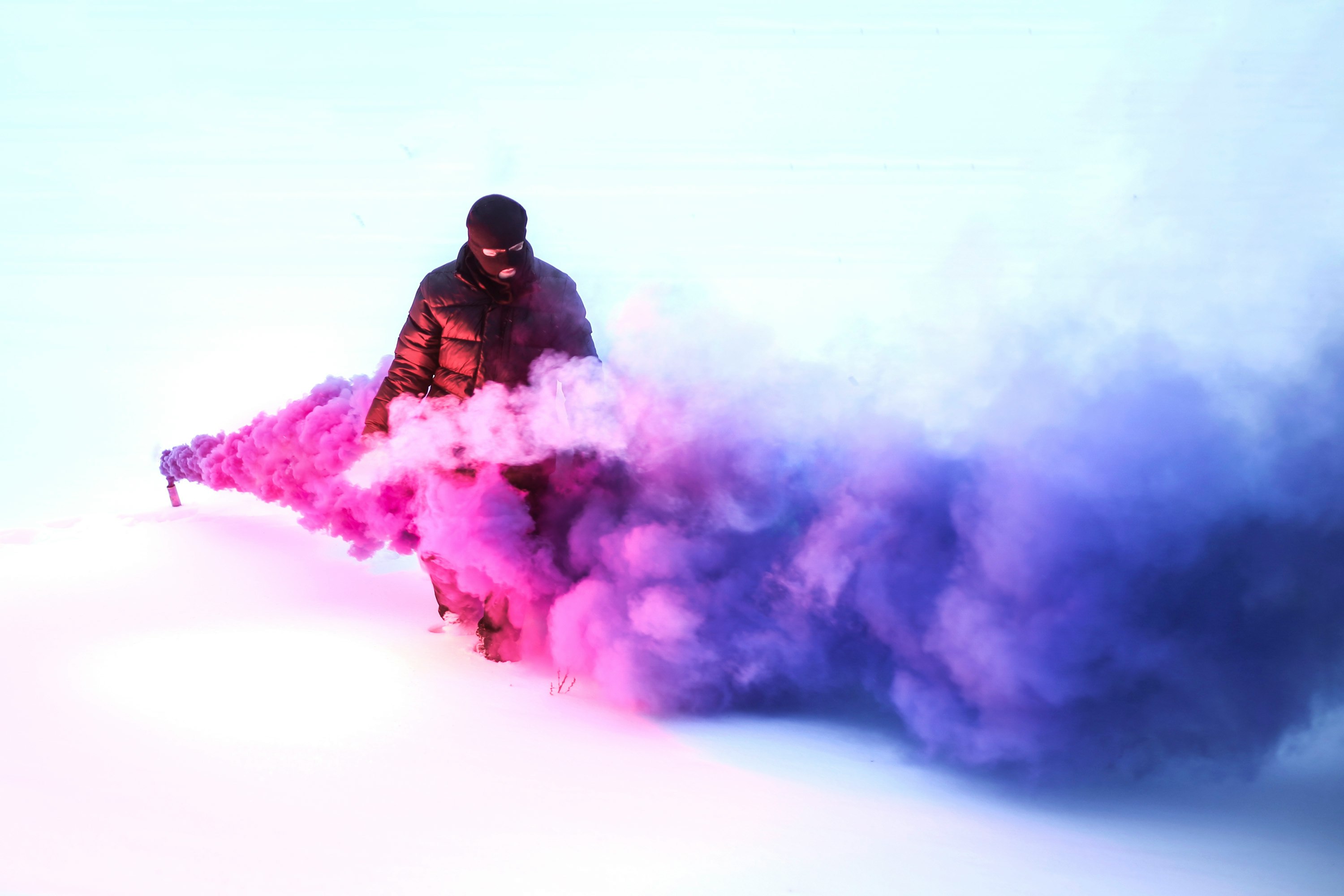 person walking on purple smoke